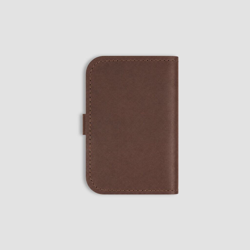 Back of brown leather notebook on a white background