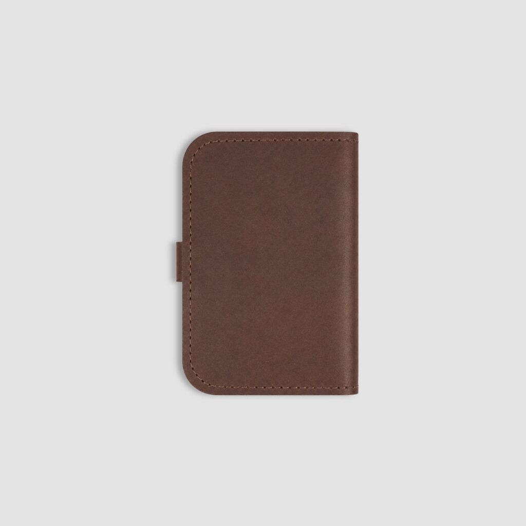Back of brown leather notebook on a white background