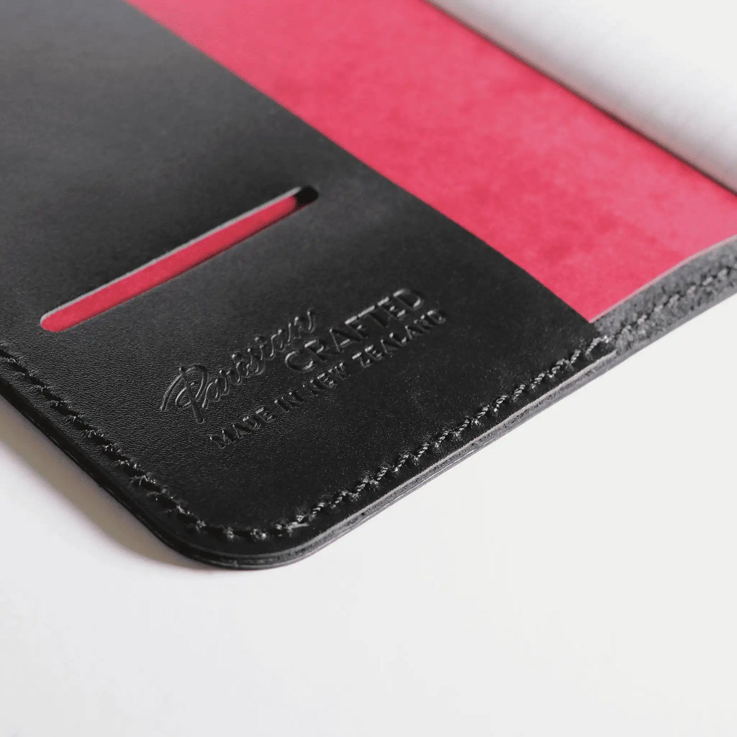 Close-up of the interior of an A5 black leather notebook, featuring elegant embossed Parisian Crafted branding —a genuine leather journal with timeless style and quality craftsmanship.