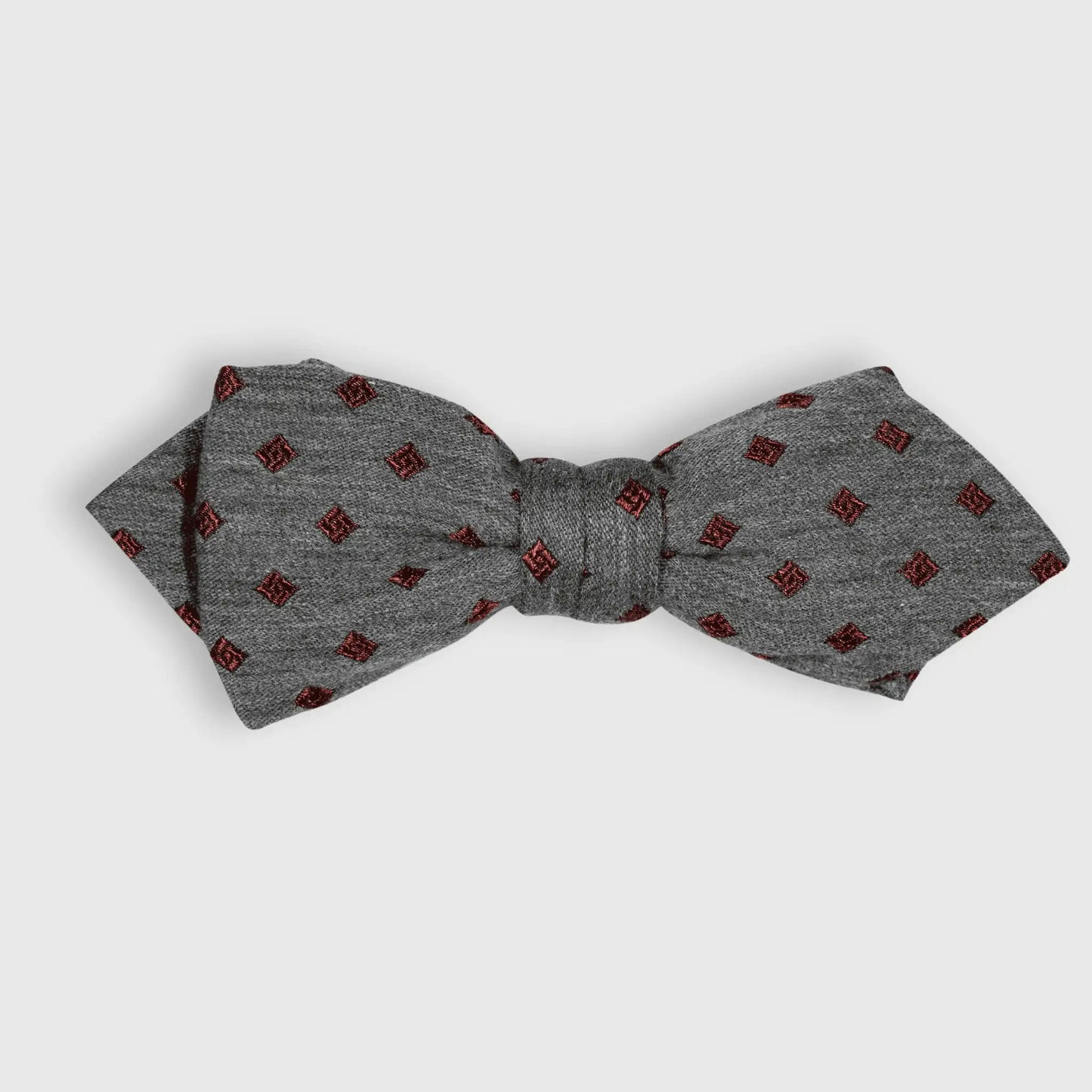 Grey self-tied bow tie with burgundy diamond pattern, classic formal menswear accessory for elegant styling, made locally in New Zealand.