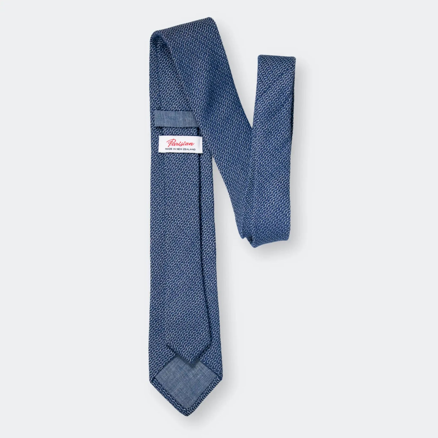 Back of Mid Blue and White Jacquard Tie with 'Parisian Made in New Zealand' woven label - premium craftsmanship.