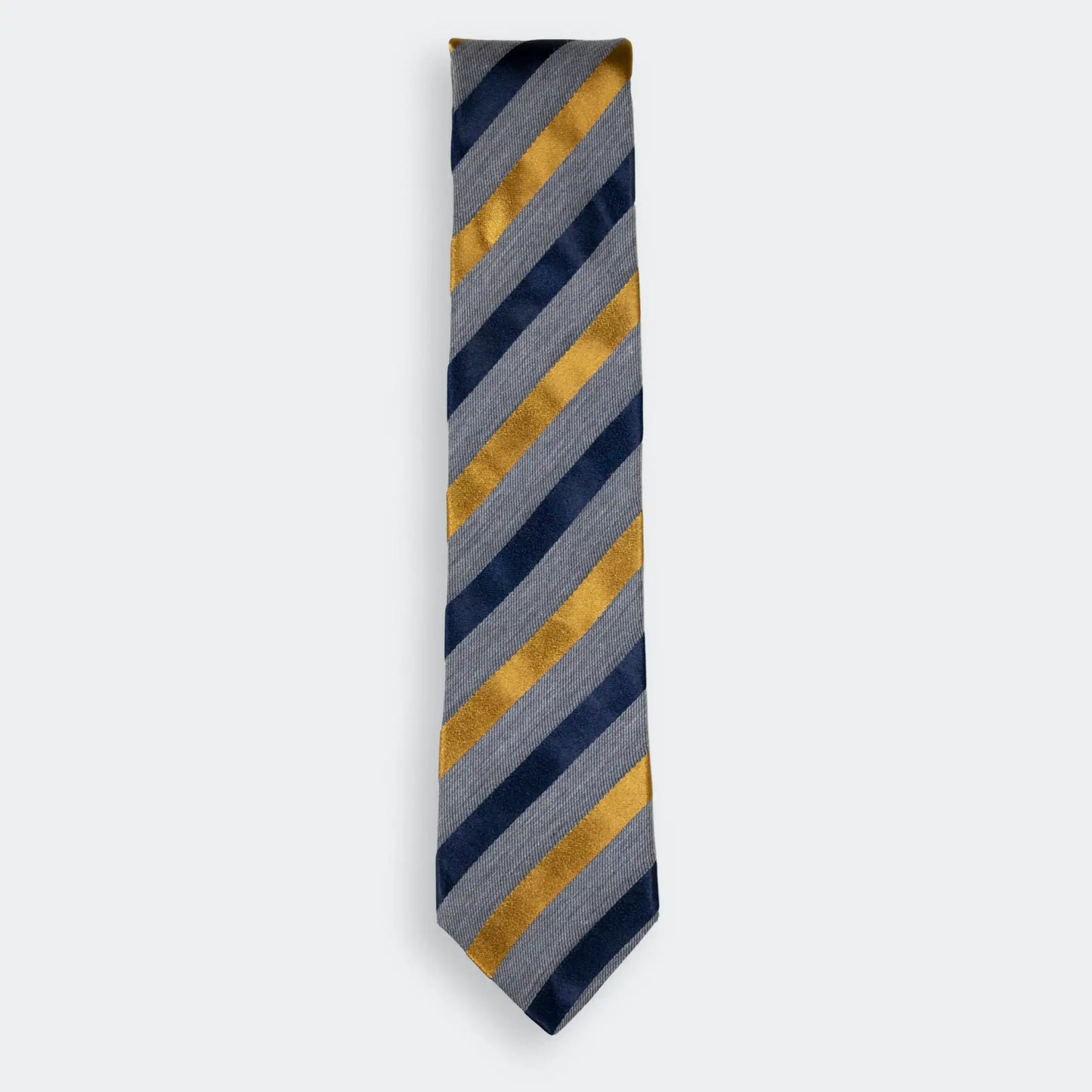 Grey woven tie with navy and gold satin stripes, folded neatly on a white background - NZ Made men's neck-wear.