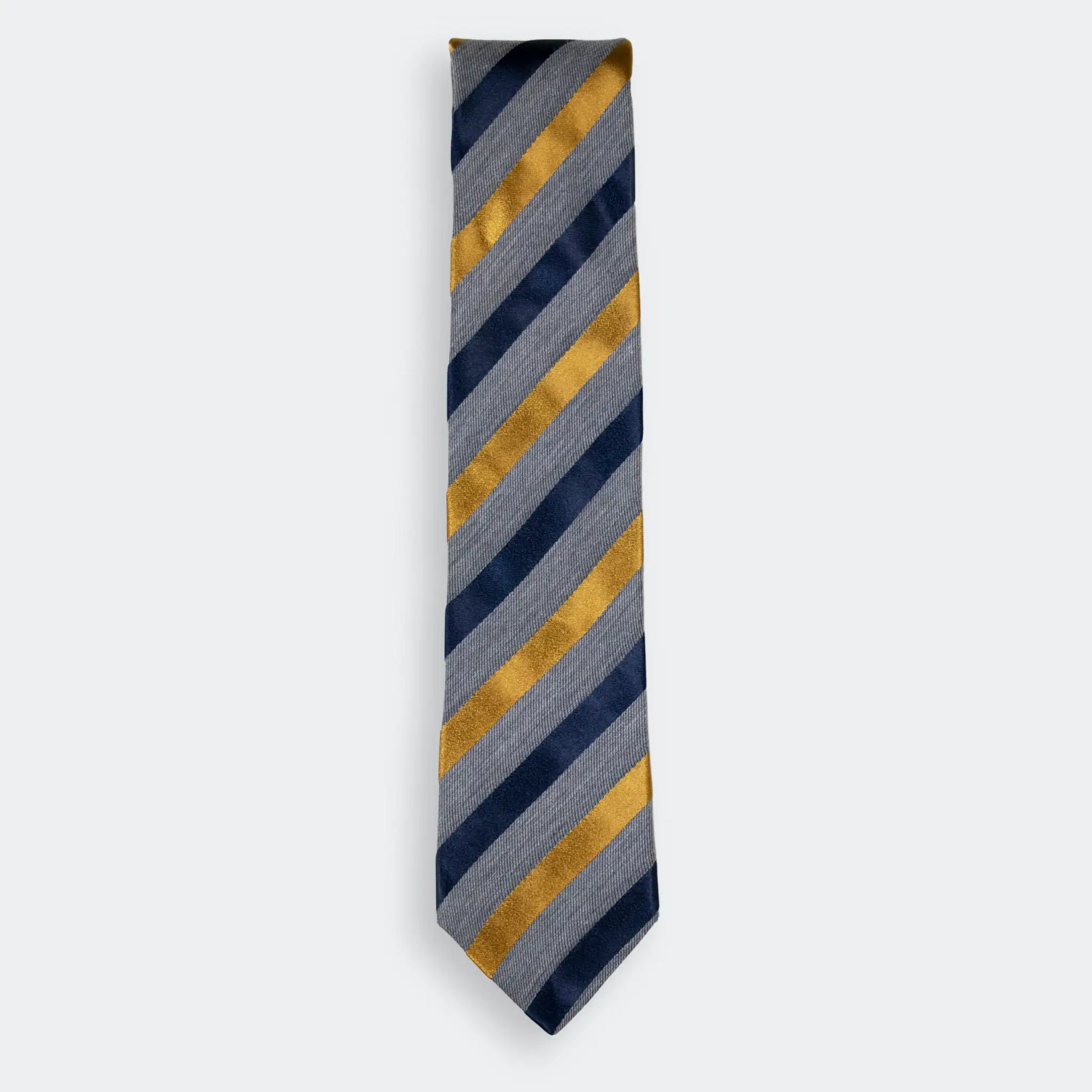 Grey woven tie with navy and gold satin stripes, folded neatly on a white background - NZ Made men's neck-wear.