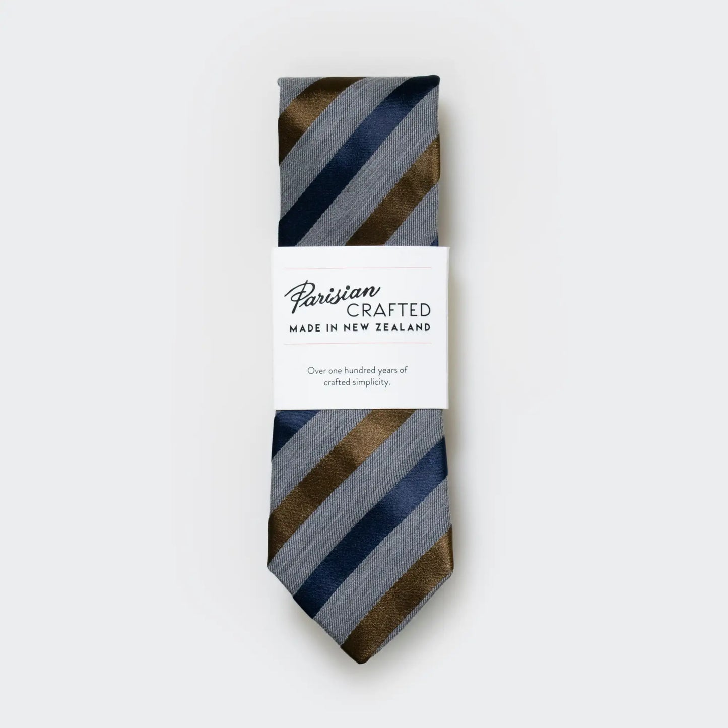 Grey marle men's tie with navy and tobacco satin stripes, packaged into Parisian Crafted's signature white sleeve with bold logo.
