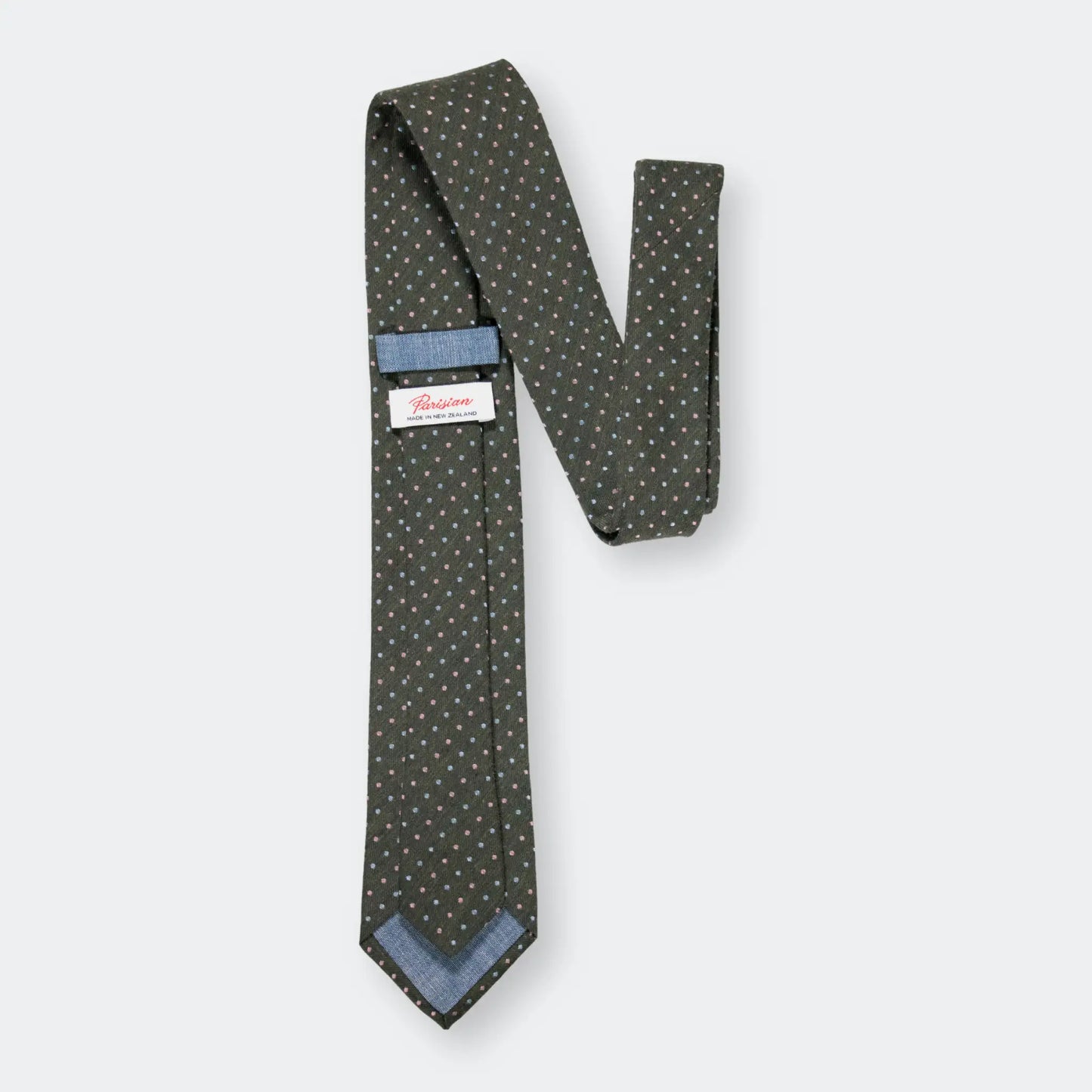 Back of olive green sky and pink pin-dot design tie with 'Parisian Made in New Zealand' woven label.