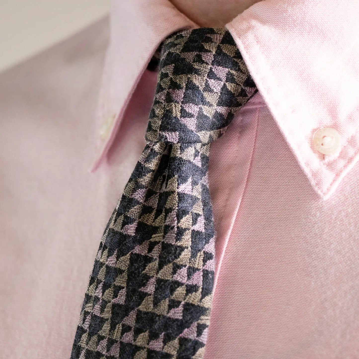 Textured sage, navy and pink geometric pattern tie complementing a light pink button-down shirt - exclusive Parisian Crafted neck-wear