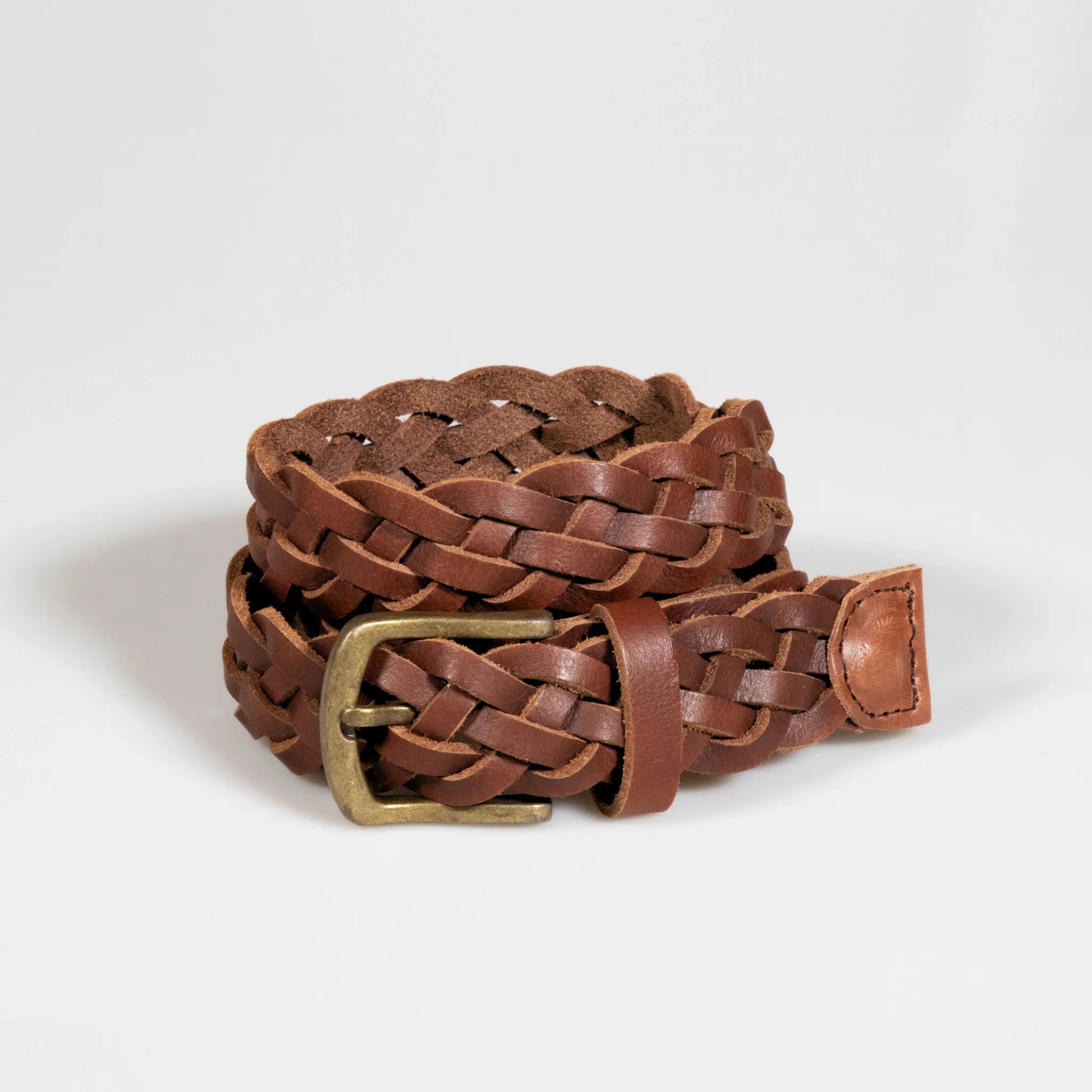 Men's brown leather belt with hand-woven plait design, showcasing expert craftsmanship. Made in New Zealand with high-quality genuine leather.