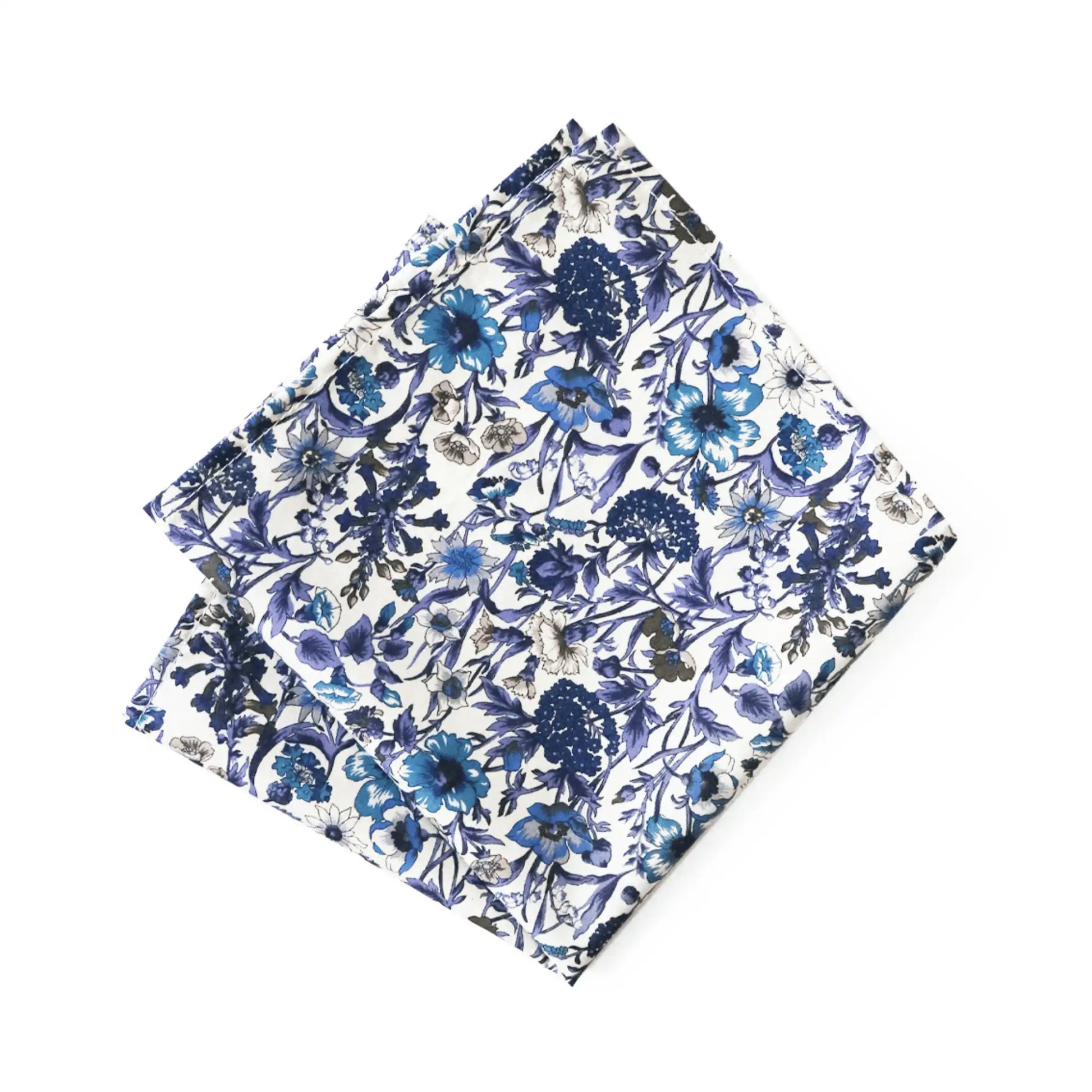 Liberty London’s Rachel Tana Lawn fabric pocket square featuring blue and purple floral design on white. Parisian Crafted x Liberty collaboration with vibrant wildflowers—premium accessory for menswear.