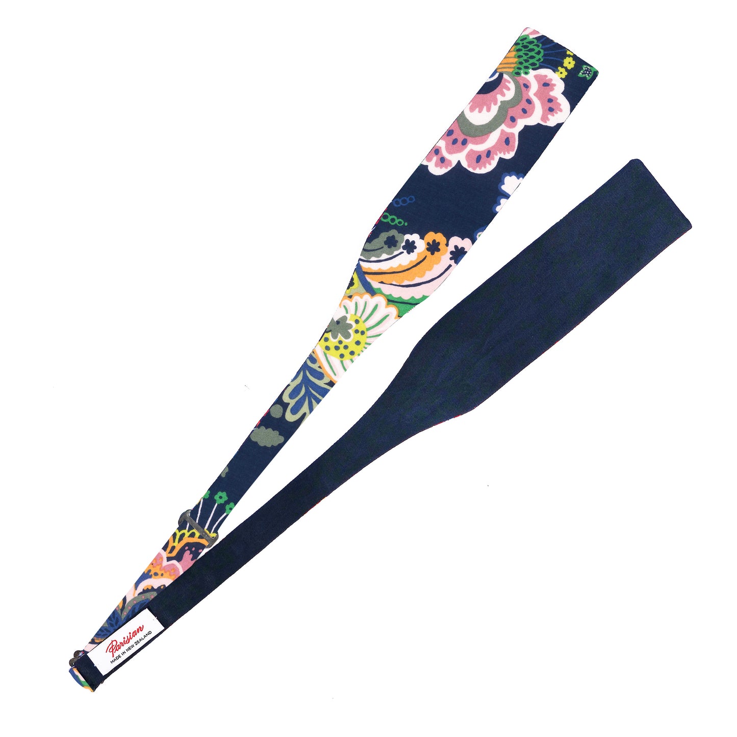 The Symphony Tie Your Own Bow lying on a white background showing the woven 'Parisian Made in New Zealand' label.