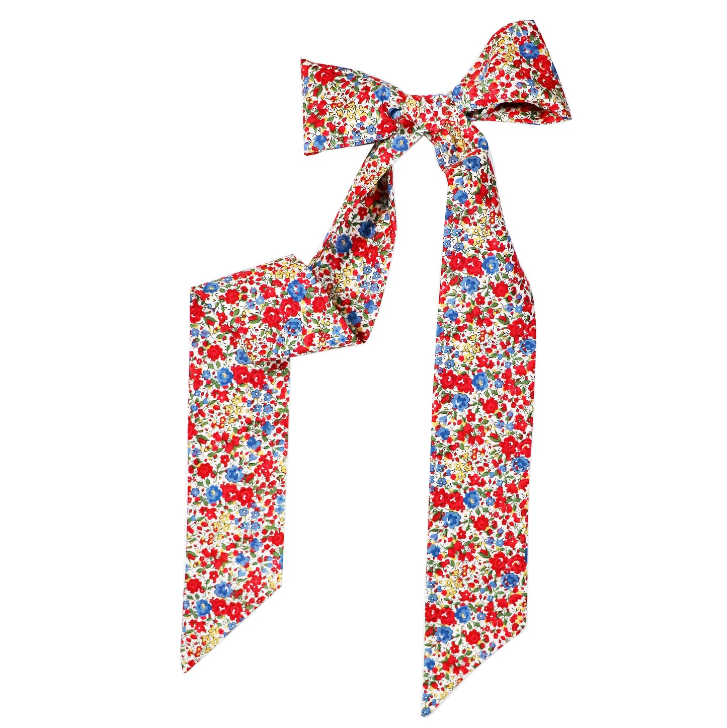 The Emma & Georgina Twilly tied in a bow sitting on a white background.