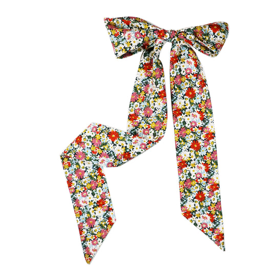 The Libby Twilly tied into a bow lying on a white background.