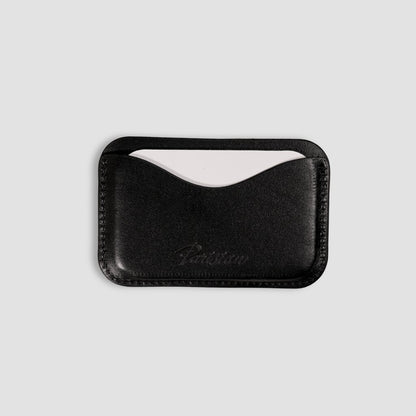 Black leather cardholder with a Parisian branding on a white background