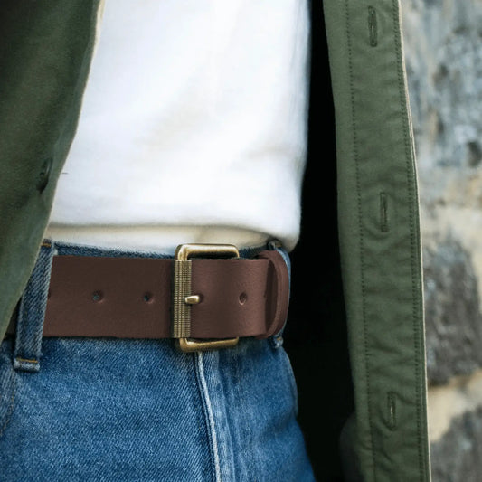 Rustic mocha leather work belt worn with jeans, t-shirt and green shirt. 
