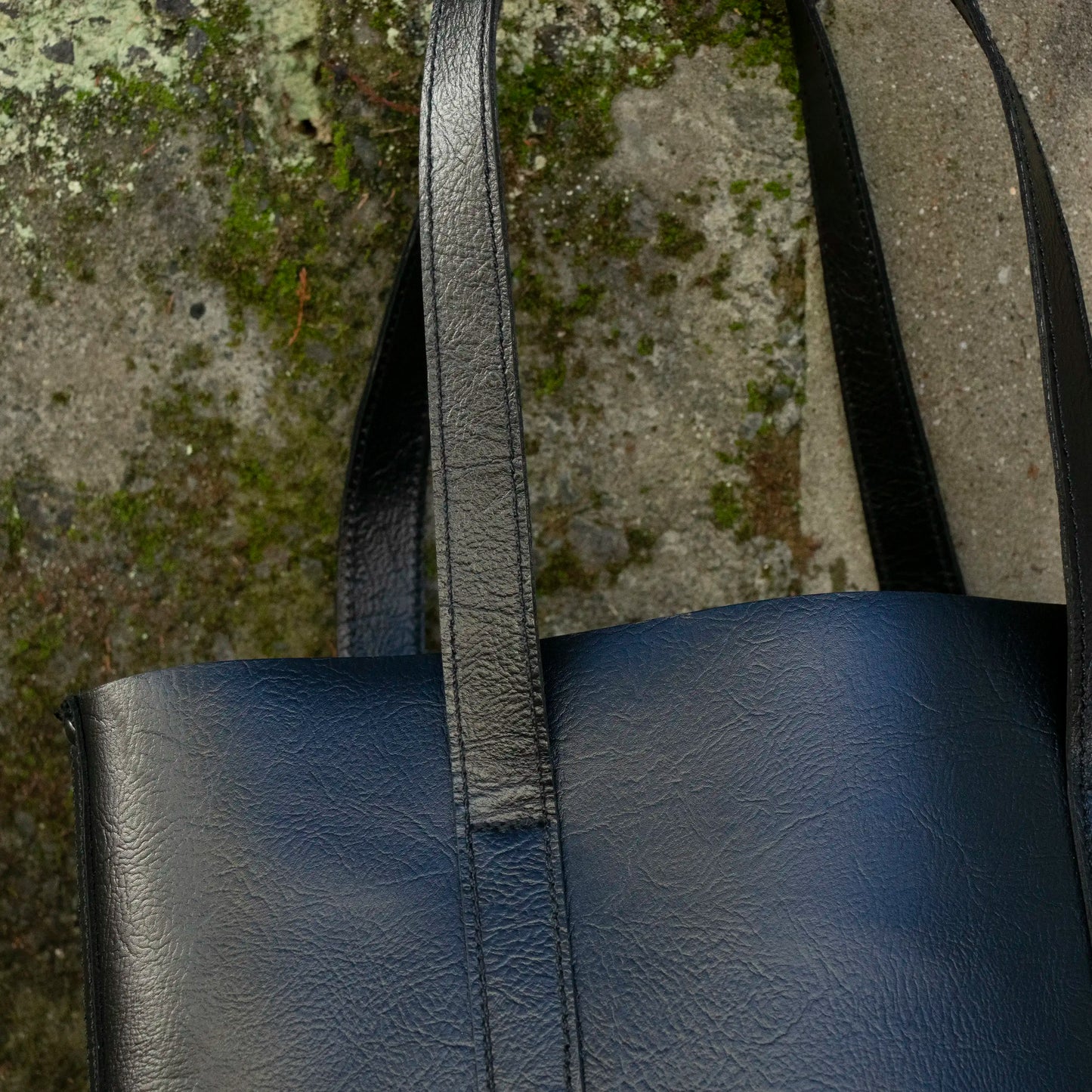 A close up of the Strap on the Black Everyday Leather Tote.