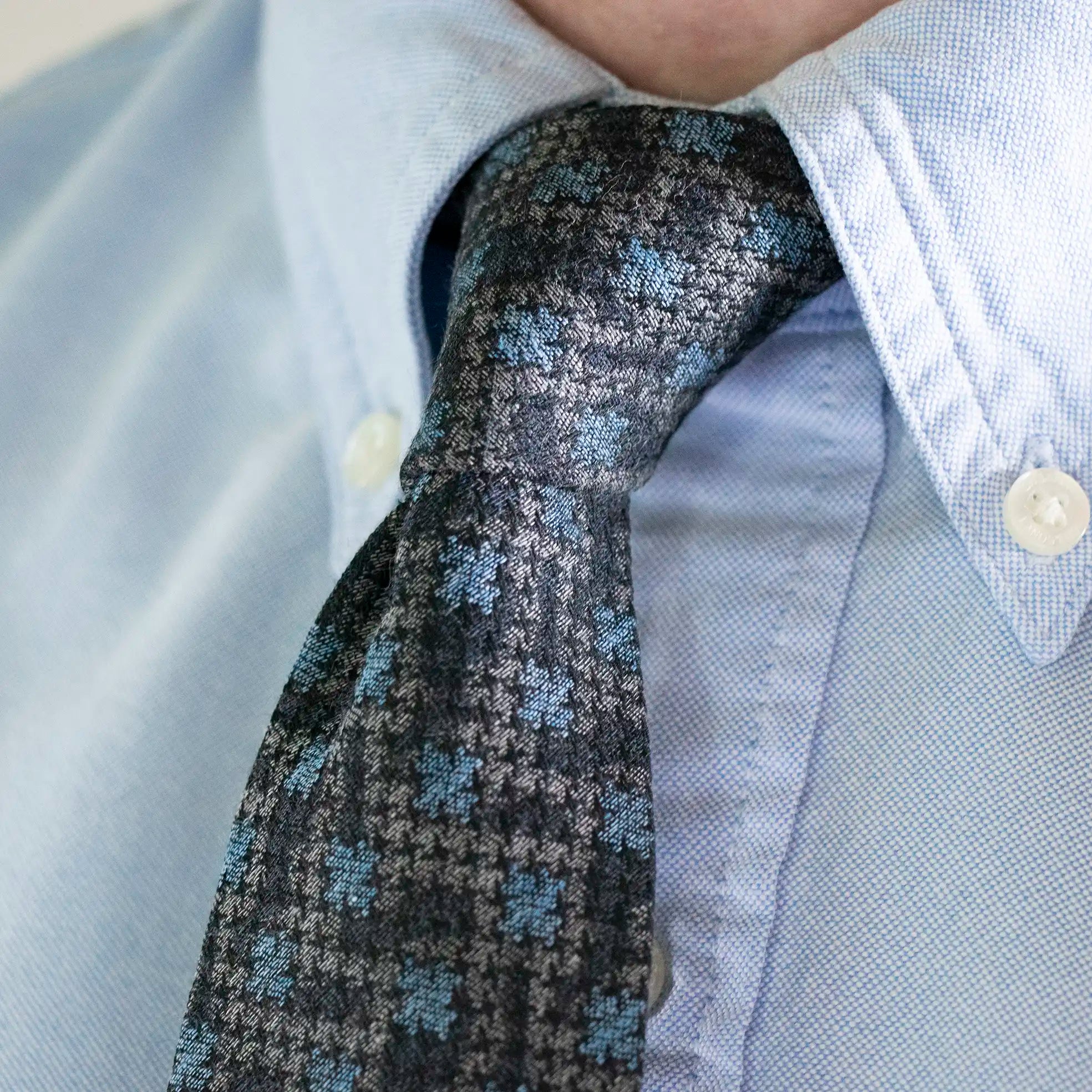 The Slate Blue Abstract Houndstooth Tie worn with a Soft Blue Button Down Shirt.