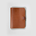 The Tan Leather Notebook on a white background.