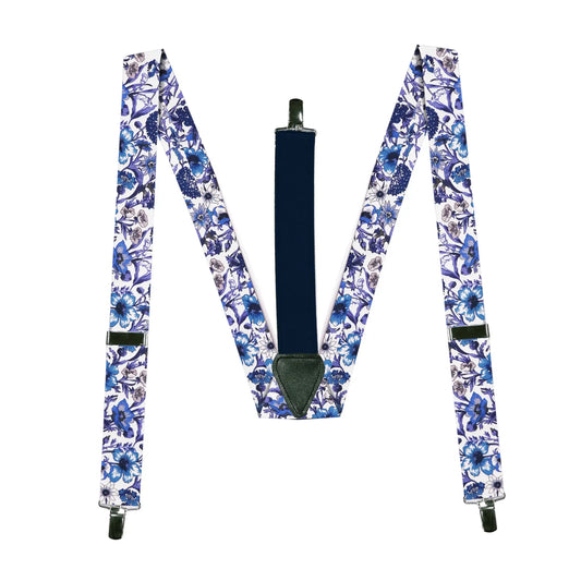 Blue purple and white braces with a floral pattern from a collaborative Parisian and Liberty London collection, lying flat on a white background.