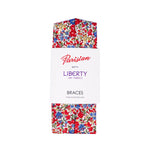 The Emma & Georgina Braces folded up in their white card Parisian with Liberty packaging, on a white background.