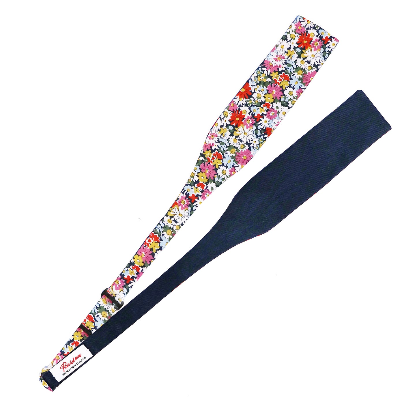 The Libby Tie Your Own Bow lying on a white background showing the woven 'Parisian Made in New Zealand' label.
